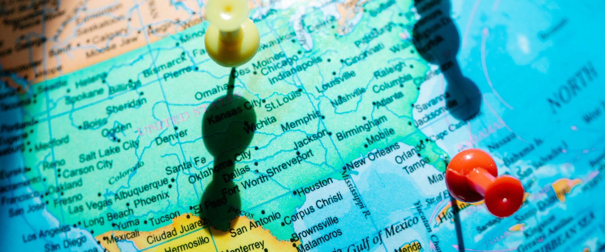 Detailed map of North America featuring pushpins highlighting regions in Mexico and the US.